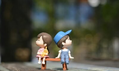 Boy and Girl Sitting on Bench Toy