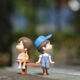 Boy and Girl Sitting on Bench Toy